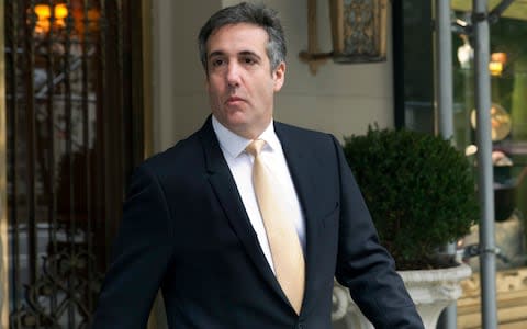 Michael Cohen, former personal lawyer to president Donald Trump, leaves his apartment building, in New York - Credit: AP Photo/Richard Drew