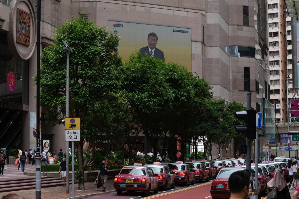 A TV screen shows the live broadcast of China's President Xi Jinping's speech following a swearing-in ceremony to inaugurate the city's new leader and government in Hong Kong, Friday, July 1, 2022. The city on Friday marked the 25th anniversary of its return to Chinese rule. (AP Photo/Kin Cheung)