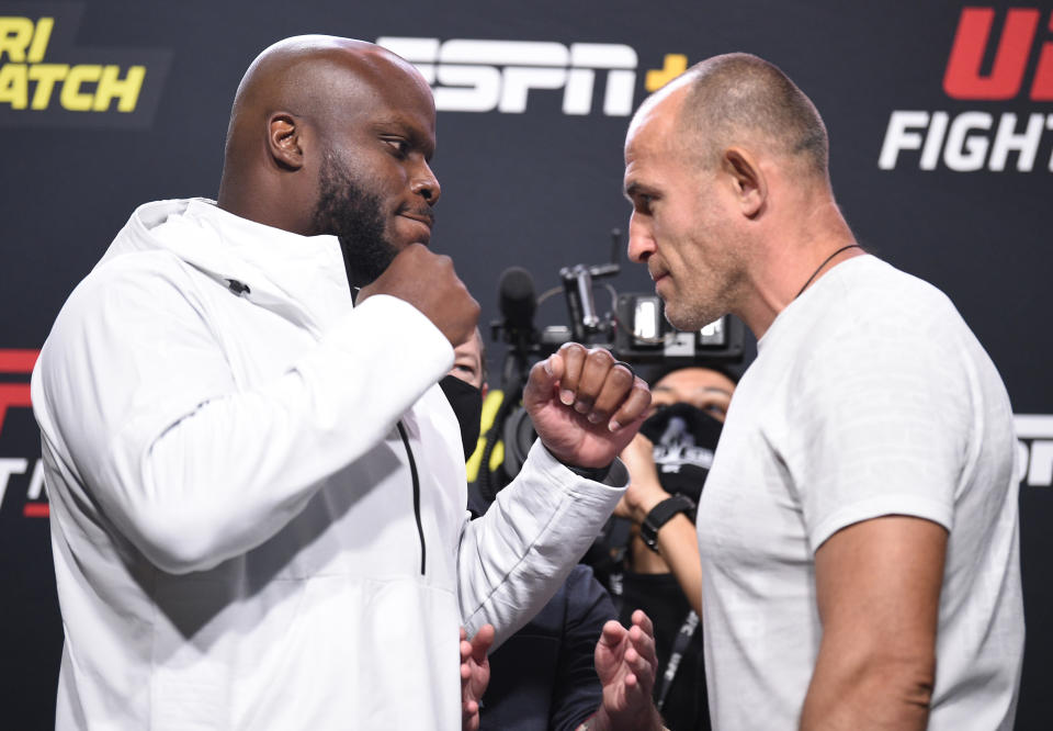 LAS VEGAS, NEVADA - AUGUST 07: (L-R) Opponents Derrick Lewis and Aleksei Oleinik of Russia face off during the UFC Fight Night weigh-in at UFC APEX on August 07, 2020 in Las Vegas, Nevada. (Photo by Chris Unger/Zuffa LLC)