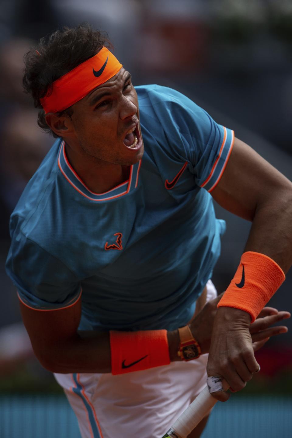 Rafael Nadal, from Spain, returns the ball to Felix Auger-Aliassime, from Canada, during the Madrid Open tennis tournament in Madrid, Wednesday, May 8, 2019. (AP Photo/Bernat Armangue)