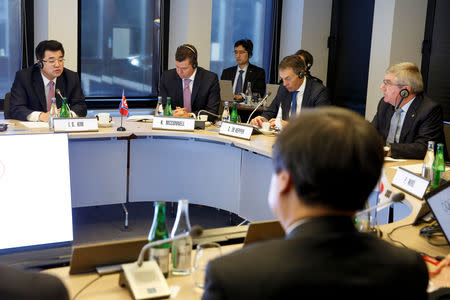 North Korea's Olympic Committee President and Minister of Physical Culture and Sports Kim Il Guk, speaks to South Korean Sports Minister Do Jong-hwan, as International Olympic Committee (IOC) President Thomas Bach, from Germany looks on during a discussion with the International Olympic Committee for their bid to co-host the 2032 Summer Olympics, at the IOC Headquarters in Lausanne, Switzerland, Friday, February 15, 2019. Salvatore Di Nolfi/Pool via REUTERS
