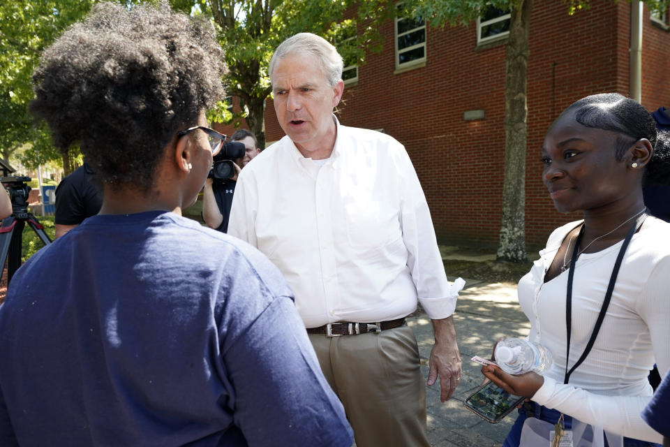 Jackson State University students listen as Democratic candidate for governor Brandon Presley, center, speaks with them during a JSU Votes Civic Engagement Initiative on National Voter Registration Day, Tuesday, Sept. 19, 2023, in Jackson, Miss. Several student groups hosted the voter registration drive and provided a forum for students and candidates to meet prior to upcoming local and state elections. (AP Photo/Rogelio V. Solis)