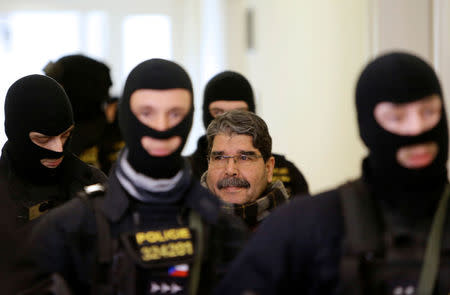 Kurdish Democratic Union Party (PYD) former leader Saleh Muslim is escorted to a Czech court, which will rule on his custody pending extradition proceedings requested by Turkey, in Prague, Czech Republic, February 27, 2018. REUTERS/David W Cerny