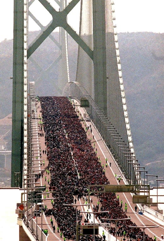 Some 80,000 people walking on Akashi Kaikyo bridge, the world's longest suspension bridge in Kobe, western Japan, one month before it opened in 1998