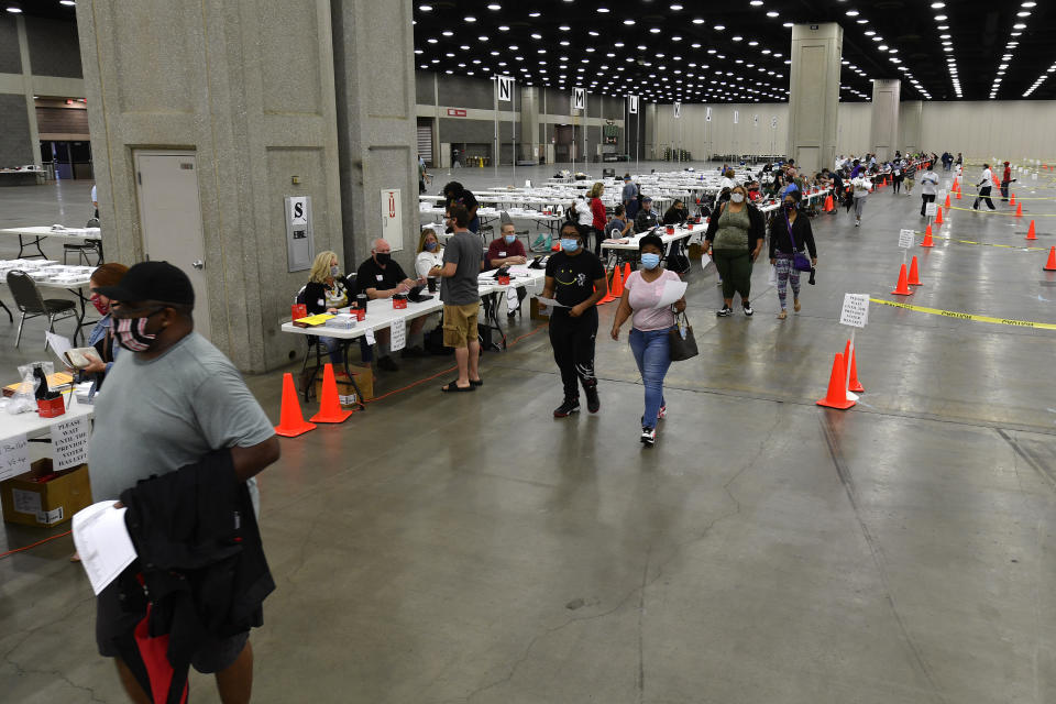 Voters head to the designated area to fill out their ballots in the kentucky primary at the Kentucky Exposition Center in Louisville, Ky., Tuesday, June 23, 2020. In an attempt to prevent the spread of the coronavirus, neighborhood precincts were closed and voters that didn't cast mail in ballots were directed to one central polling location. (AP Photo/Timothy D. Easley)