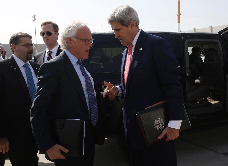 US Secretary of State John Kerry (R ) speaks with Martin Indyk, US Special Envoy for Palestinian-Israeli negotiations, in Tel Aviv on November 8, 2013