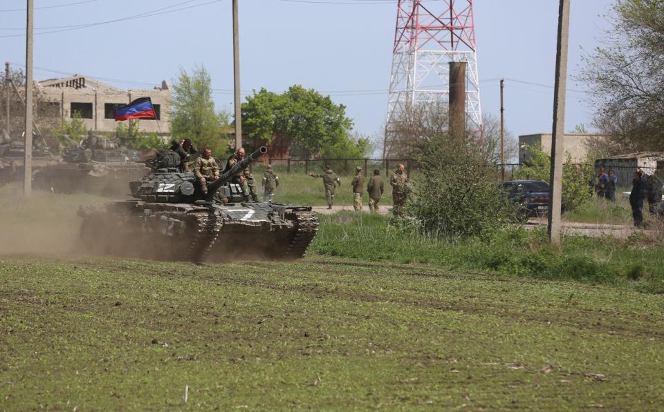 MARIUPOL, UKRAINE - MAY 06: Tanks of the DPR army move on the field during several dozen Ukrainian civilians, who had been living in the bomb shelters of the Azovstal plant for more than a month, being evacuated in Mariupol, Ukraine on May 06, 2022 - Anadolu Agency