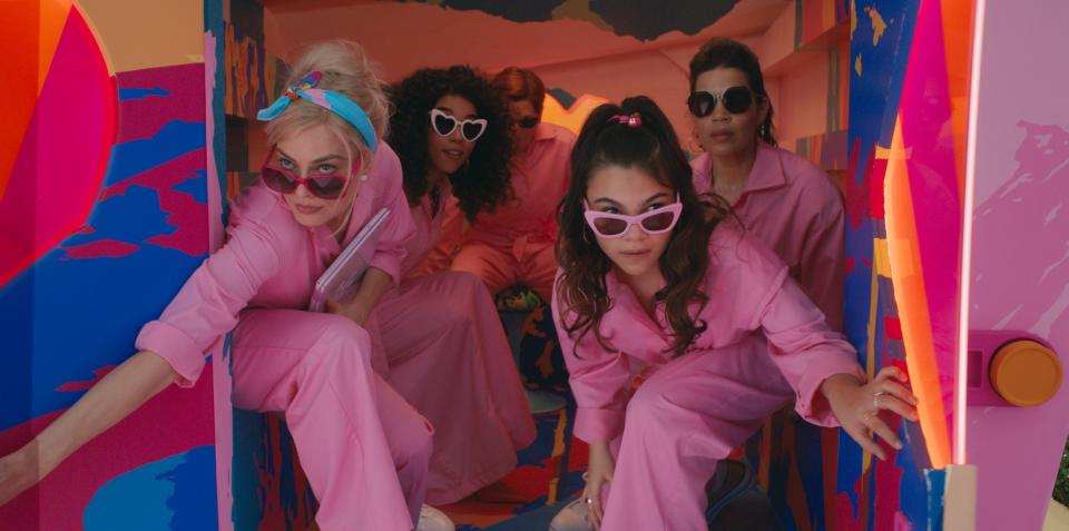 A pair of Barbies (Margot Robbie, far left, and Alexandra Shipp) go on a high-stakes mission with their doll pal Allan (Michael Cera) and a couple of humans, Sasha (Ariana Greenblatt) and Gloria (America Ferrera), in "Barbie."
