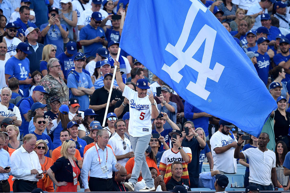 <p>True-blue Dodgers fan Rob Lowe led the crowd in cheers and ran into legendary retired Dodgers announcer Vin Scully during his night at the ballpark.“If Heaven is real, it’s probably something like this,” he tweeted. (Photo: Kevork Djansezian/Getty Images) </p>