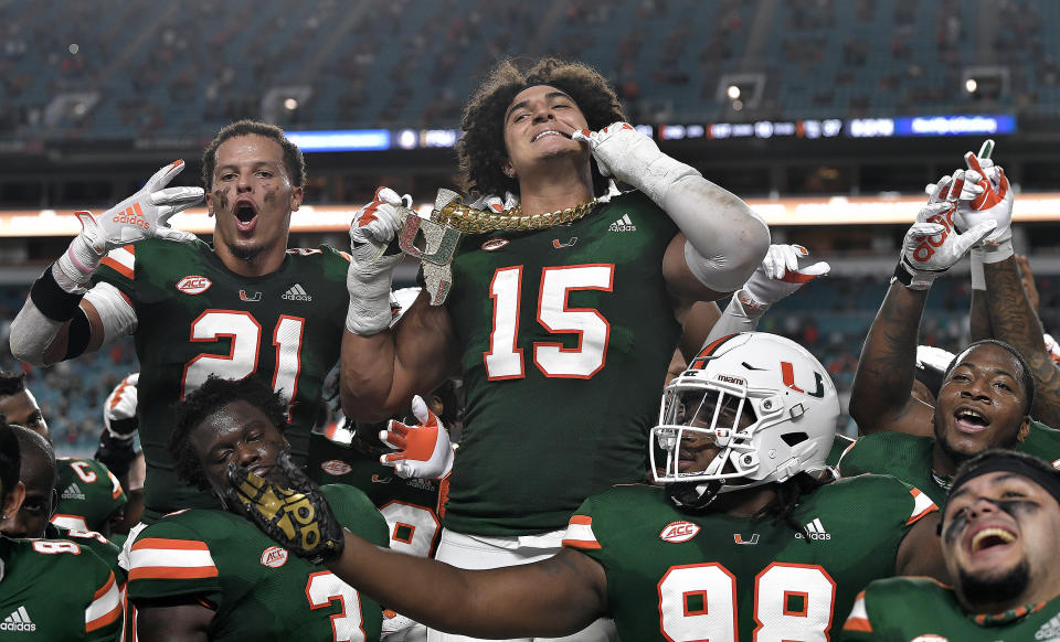 Miami lineman Jaelan Phillips displays the tunover chain after intercepting a Florida State pass during the first half of an NCAA college football game Saturday, Sept. 26, 2020, in Miami Gardens, Fla. (Michael Laughlin/South Florida Sun-Sentinel via AP)