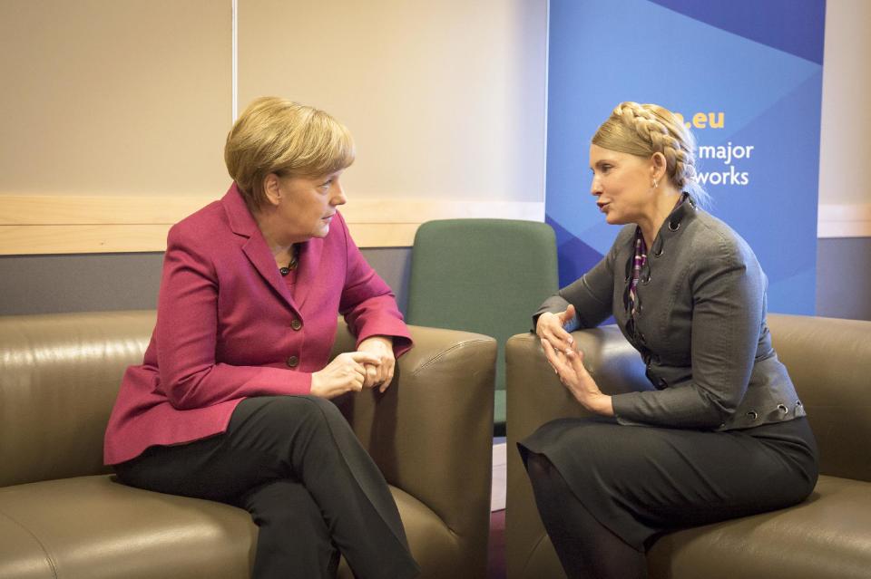 In this picture provided by the German government German Chancellor Angela Merkel, left, meets with Ukrainian politician Yulia Tymoshenko. right, on the occasion of a meeting of the European peoples parties in Dublin, Ireland, Friday, March 7, 2014. (AP Photo/German Government/Guido Bergmann)