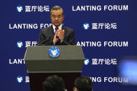 Chinese Foreign Minister Wang Yi attends a symposium to mark the 50th anniversary of the People's Republic of China's entry into the U.N. at the Foreign Ministry in Beijing on Friday, June 25, 2021. Foreign Minister Wang Yi said China remains deeply committed to United Nations peacekeeping efforts, where more than 2,400 Chinese troops and police are serving, a contribution that underscores China's increasing prominence in the world body. (AP Photo/Ng Han Guan)