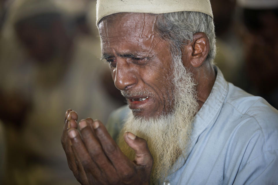 A Rohingya refugee cries as he prays with others inside a mosque at Unchiprang refugee camp near Cox's Bazar, in Bangladesh, Friday, Nov. 16, 2018. Normal life returned to a Rohingya Muslim refugee camp in Bangladesh on Friday a day after government officials postponed plans to begin repatriating residents to Myanmar when no one volunteered to go. (AP Photo/Dar Yasin)