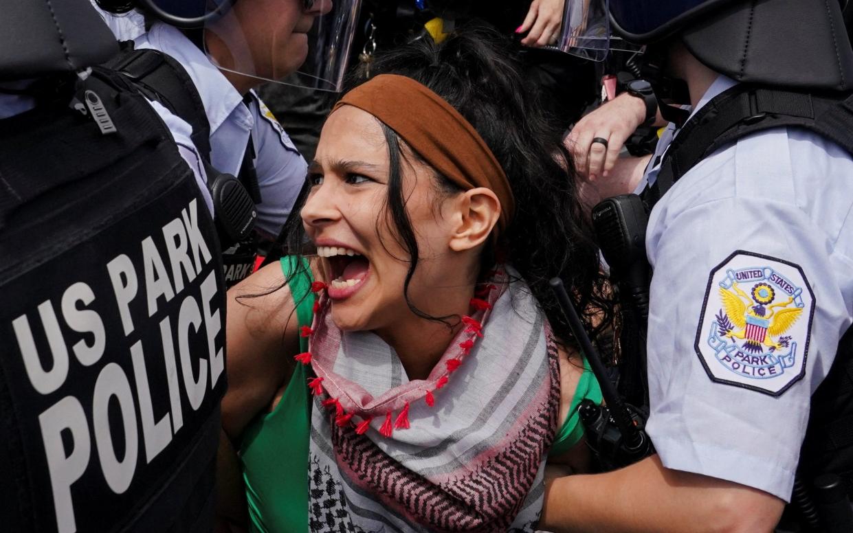 Police detain a pro-Palestinian demonstrator,