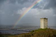 A rainbow is pictured over flooded fields in Xinzo de Limia following heavy rains. (Getty)