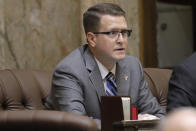 FILE - In this Feb. 19, 2020 photo, state Rep. Matt Shea, R-Spokane Valley, listens to testimony on the House floor at the Capitol in Olympia, Wash. Prominent state lawmaker Shea says the coronavirus is a foreign bio-weapon and claims Marxists are using the pandemic to advance totalitarianism. (AP Photo/Ted S. Warren, File)