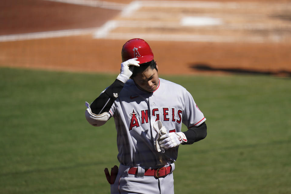 Los Angeles Angels' Shohei Ohtani walks back to the dugout after batting during the third inning of a baseball game against the San Diego Padres, Wednesday, Sept. 23, 2020, in San Diego. (AP Photo/Gregory Bull)