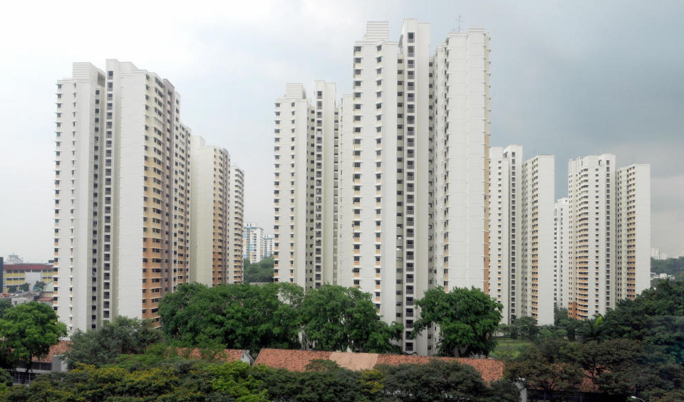 A picture of tall, white Singapore HDB flats.