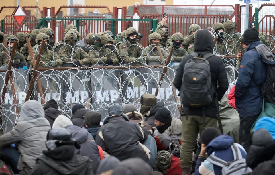 Migrants face police at the border (Leonid Shcheglov/BelTA/AP) (AP)