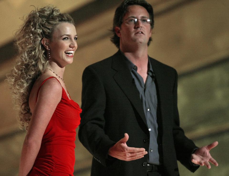 Britney Spears and Matthew Perry on stage during the 44th Annual Grammy Awards at the Staples Center on Feb. 27, 2002.