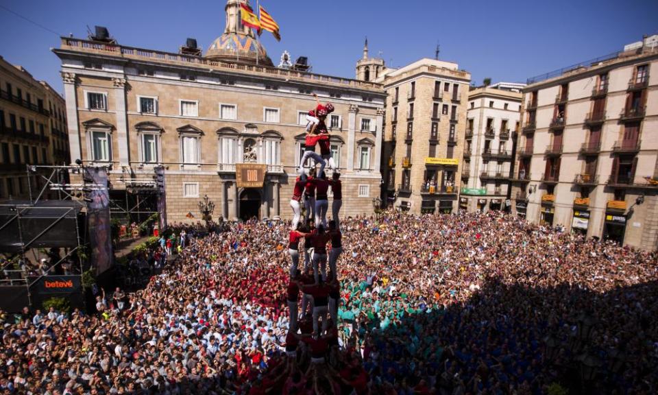 Performers form a human tower at a demonstration in in Barcelona