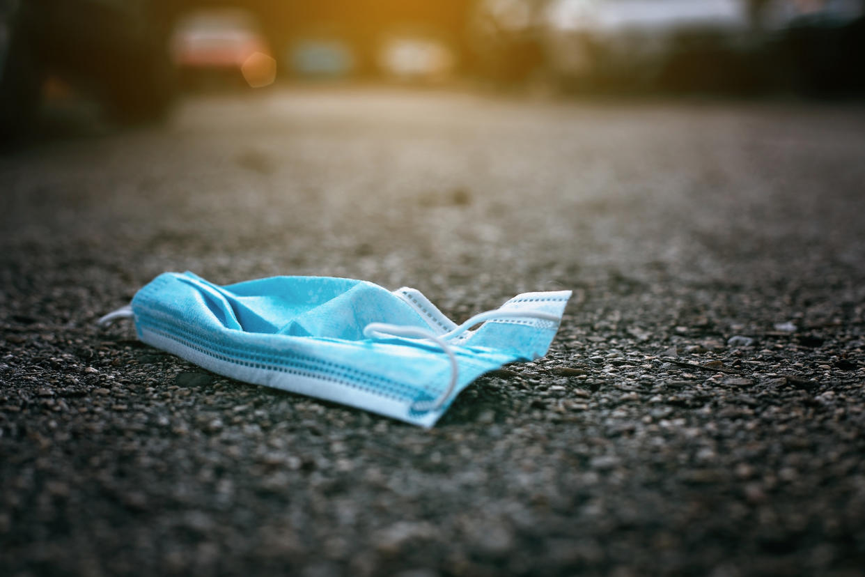 A discarded face mask