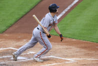 San Francisco Giants' Alex Dickerson watches as he hits a three-run home during the fourth inning of a baseball game against the Cincinnati Reds in Cincinnati, Tuesday, May 18, 2021. (AP Photo/Aaron Doster)