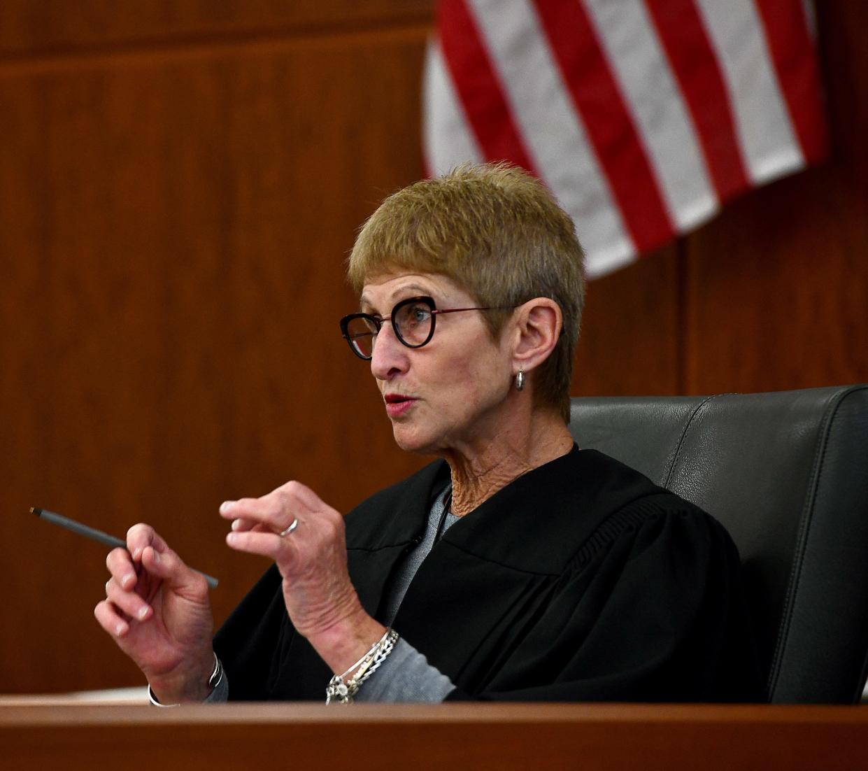 Judge Janet Kenton-Walker talks with lawyers during a hearing in the Mathew Locke case Thursday.