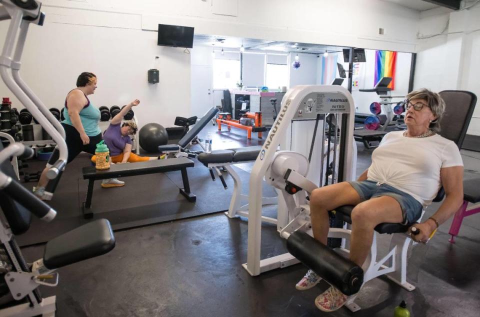 Stephanie Haskins, a transgender woman from Sacramento, works out at right as Carmichael couple Mari Morgan, left, and wife Liz Houts cool down after exercising at Queers and Allies Fitness on July 7 in East Sacramento. The gym is the first of its kind in the area dedicated to serving the LGBTQ community, especially transgender people and those who are currently transitioning.