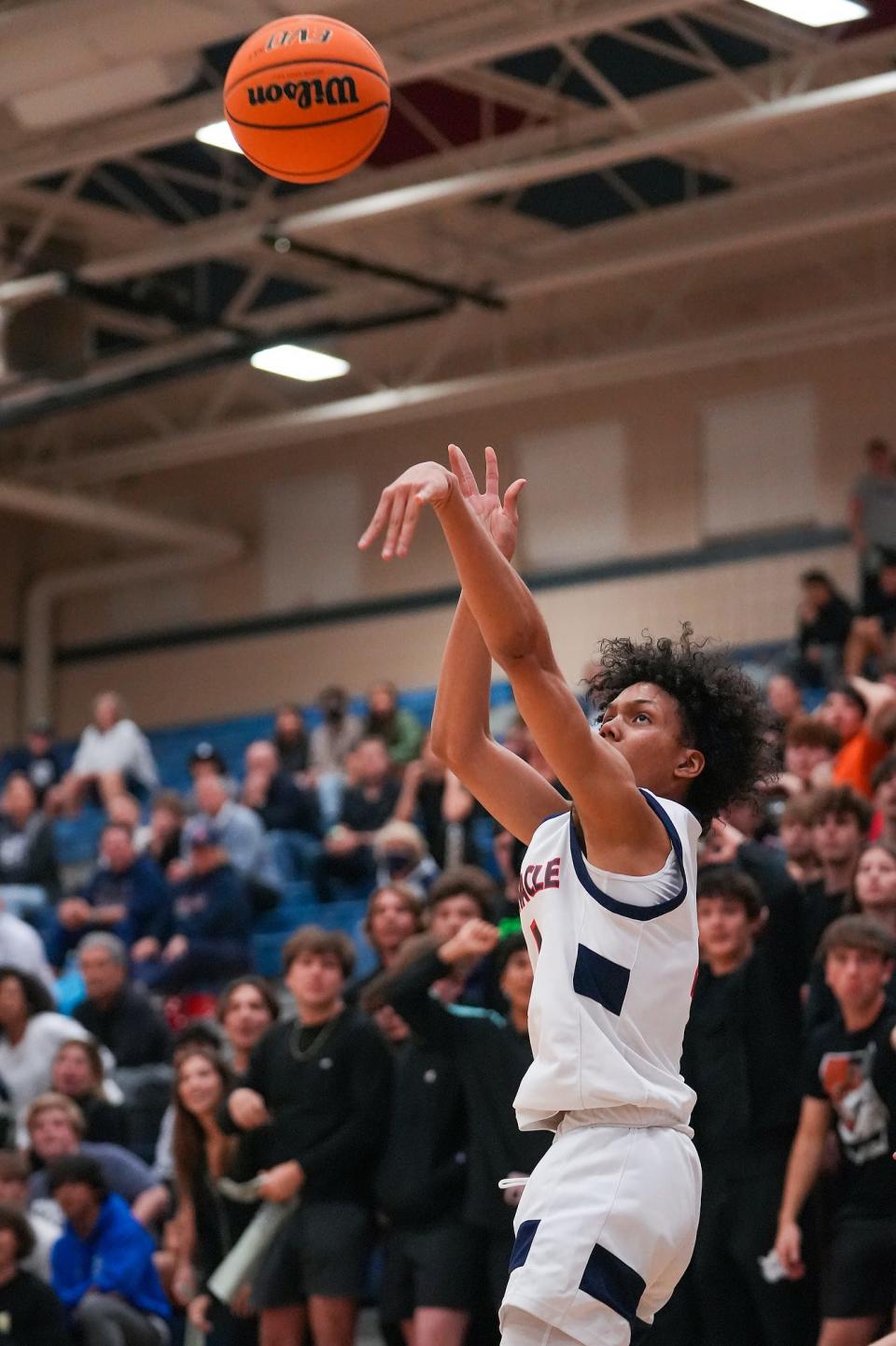 Pinnacle's Bryce Ford (4) scores an open three pointer during the second half against Liberty High School at Pinnacle High School on Thursday, Feb. 17, 2022, in Phoenix. The game finished in a 73 to 58 win to the Pioneers.