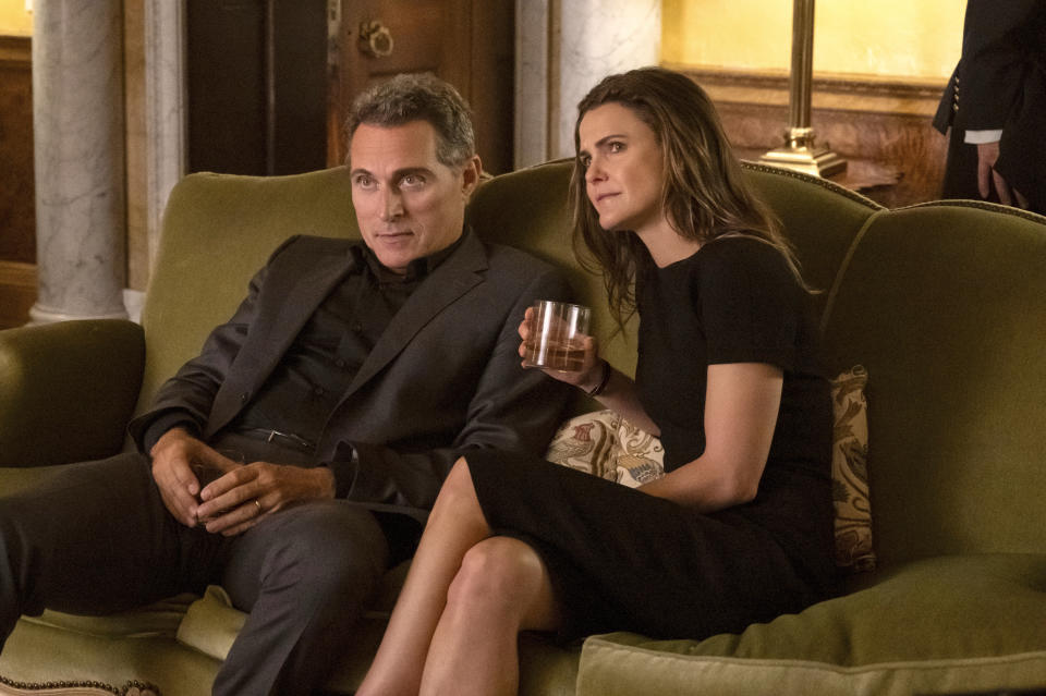 This image released by Netflix shows Rufus Sewell as Hal Wyler, left, and Keri Russell as Kate Wyler in a scene from "The Diplomat." (Netflix via AP)