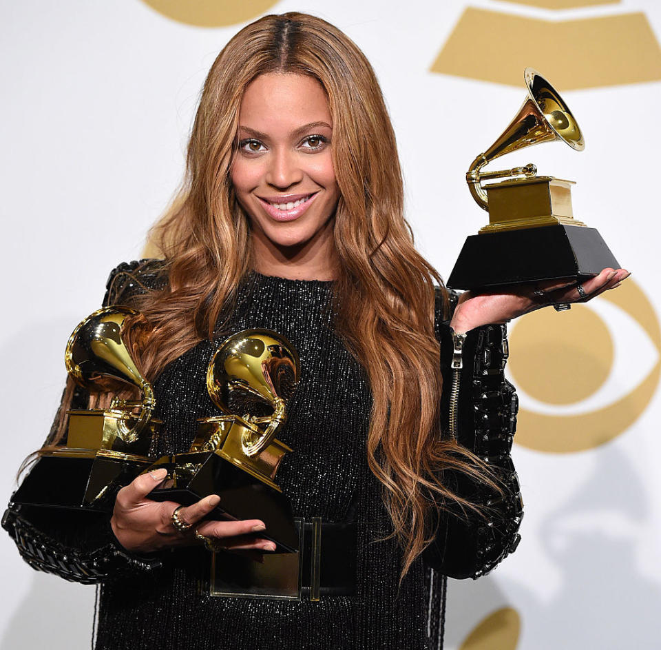 closeup of beyonce holding three grammys