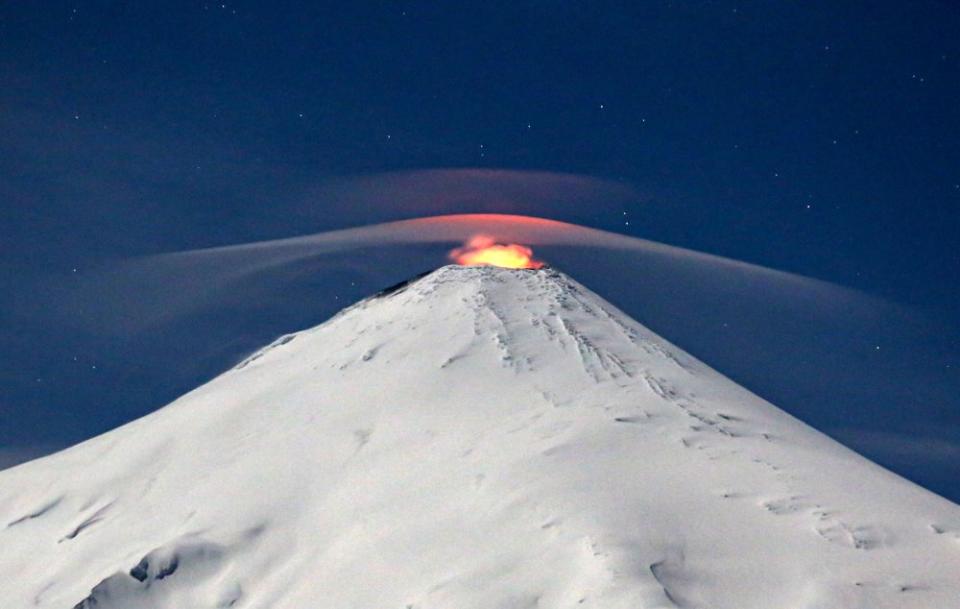 Villarrica volcano, one of the most active volcanoes in South America, is seen from Villarrica, south of Santiago, Chile, on Sept. 27. <span class="copyright">Sebastian Escobar—AFP/Getty Images</span>