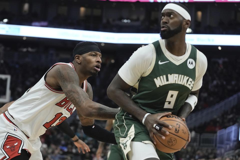 Milwaukee Bucks' Bobby Portis looks to shoot past Chicago Bulls' Torrey Craig during the first half of an NBA basketball game Monday, Dec. 11, 2023, in Milwaukee. (AP Photo/Morry Gash)