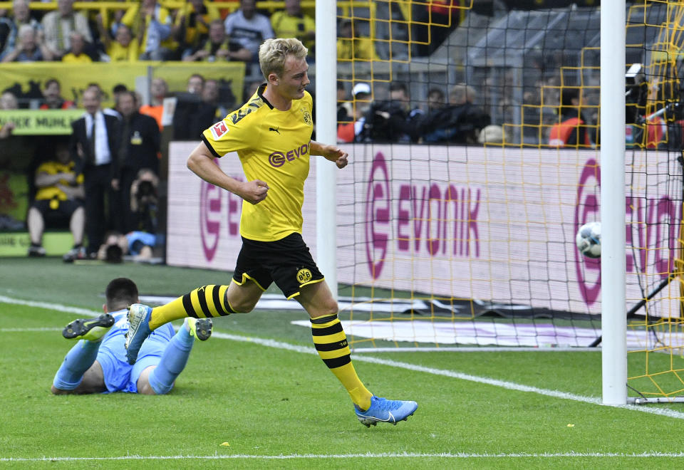 Dortmund's Julian Brandt celebrates after scoring his side's fifth goal during the German Bundesliga soccer match between Borussia Dortmund and FC Augsburg at the Signal Iduna Park stadium in Dortmund, Germany, Saturday, Aug. 17, 2019. (AP Photo/Martin Meissner)