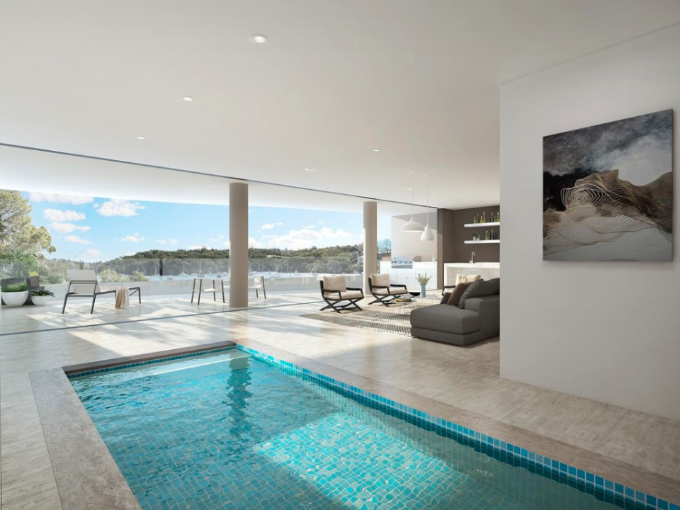 This inside peek at the original property shows an indoor pool with sweeping harbour views. Photo: realestate.com