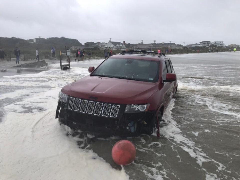 A Jeep sits in the water near Myrtle Beach on Thursday, Sept. 5, 2019.