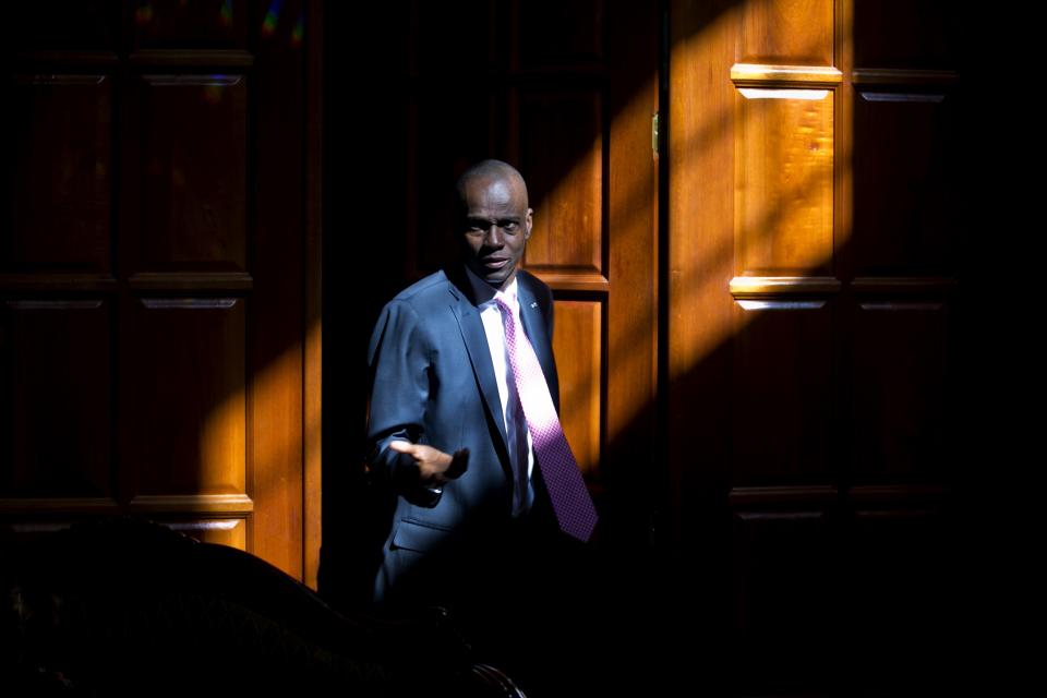 Haiti's President Jovenel Moise arrives for an interview at his home in Petion-Ville, a suburb of Port-au-Prince, Haiti, Friday, Feb. 7, 2020. Moise said Friday that he is optimistic that negotiations with a coalition of his political opponents will succeed in forging a power-sharing deal to end months of deadlock that have left the country without a functioning government. (AP Photo/Dieu Nalio Chery)