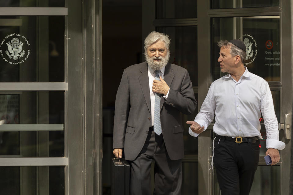 Michael Soshnick, left, attorney for Long Phi Pham, walks out of Brooklyn Federal Court, Wednesday, June 5, 2024, in New York. Soshnick declined to comment Wednesday on the case against Pham, a New York man charged in a sports betting scandal that cost former NBA player Jontay Porter his career. Pham and three co-defendants, whose names are redacted in a Brooklyn federal court complaint, are charged with conspiring to defraud a sports betting company. Man at right is unidentified. (AP Photo/Yuki Iwamura)