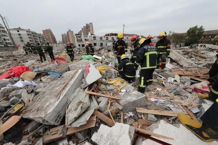 Rescue workers work at the site of a blast in Ningbo, Zhejiang province, China November 26, 2017. REUTERS/Stringer