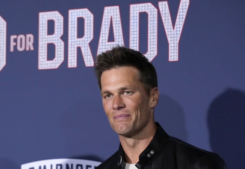 NFL quarterback Tom Brady, a cast member and producer of "80 for Brady," poses at the premiere of the film