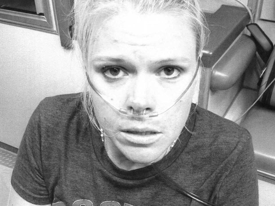 A hyperventilating Chacey Poynter was photographed as she answered questions inside an ambulance after her husband's murder. 