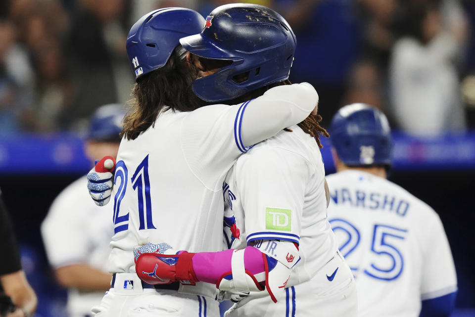 Toronto Blue Jays' Vladimir Guerrero Jr., right, celebrates his three-run home run against the Boston Red Sox with Bo Bichette during the third inning of a baseball game Friday, Sept. 15, 2023, in Toronto. (Chris Young/The Canadian Press via AP)