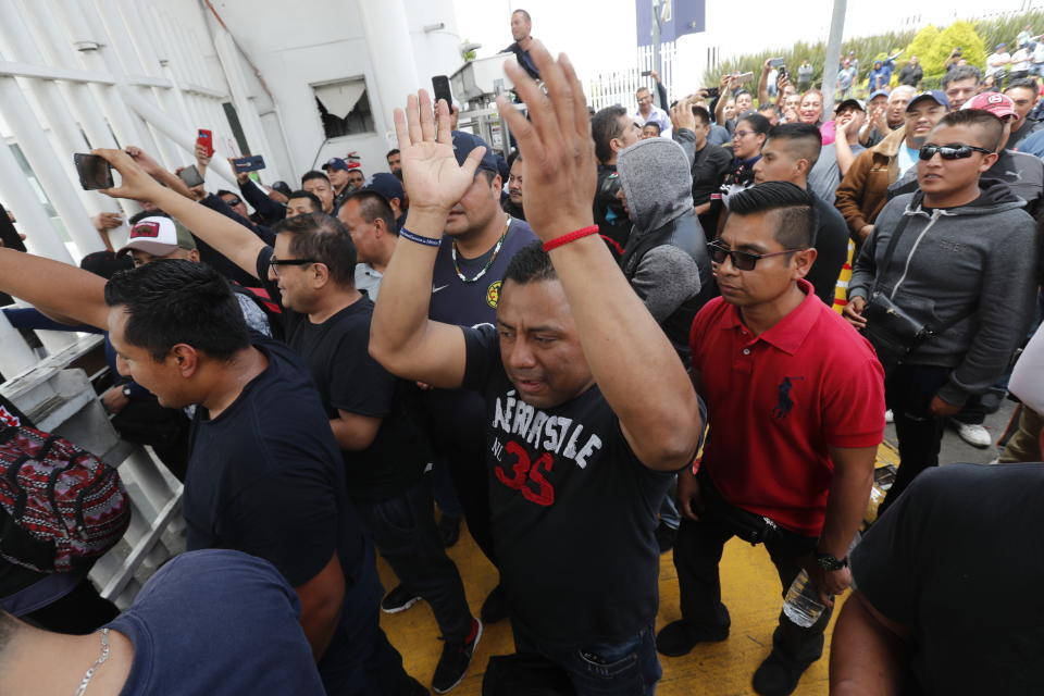 Hundreds of Mexican federal police gather at a police command center in the Iztapalapa borough, in Mexico City, Wednesday, July 3, 2019, to protest against plans to force them into the newly formed National Guard. The protest comes as the government is officially starting to deploy the National Guard to several states to fight crime and control immigration. (AP Photo/Marco Ugarte)