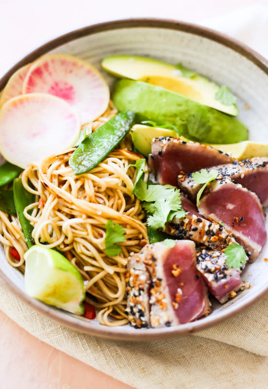 <p>These seared tuna and soba noodle stir fry bowls are easy to make if you can find quality fresh tuna to work with. Once you have that, the rest comes easy!</p><p><strong>Get the recipe: <a href="https://thedefineddish.com/seared-tuna-soba-noodle-bowls/" rel="nofollow noopener" target="_blank" data-ylk="slk:Seared Tuna Soba Noodle Bowls;elm:context_link;itc:0;sec:content-canvas" class="link "><em>Seared Tuna Soba Noodle Bowls</em></a></strong></p>