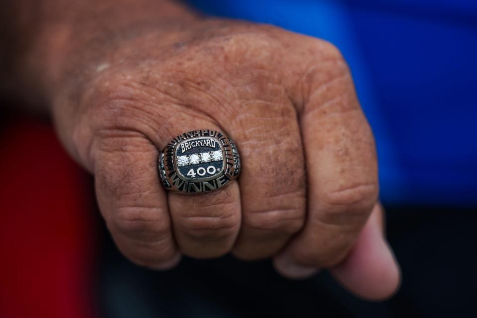 Gary Johnson, father of Chip Ganassi Racing driver Jimmie Johnson, shows his four-time Brickyard 400 championship ring Wednesday, May 18, 2022, at Indianapolis Motor Speedway. Johnson, who used to work on his son's NASCAR pit crew, will now be a spotter in turn three for his Indianapolis 500 debut. 