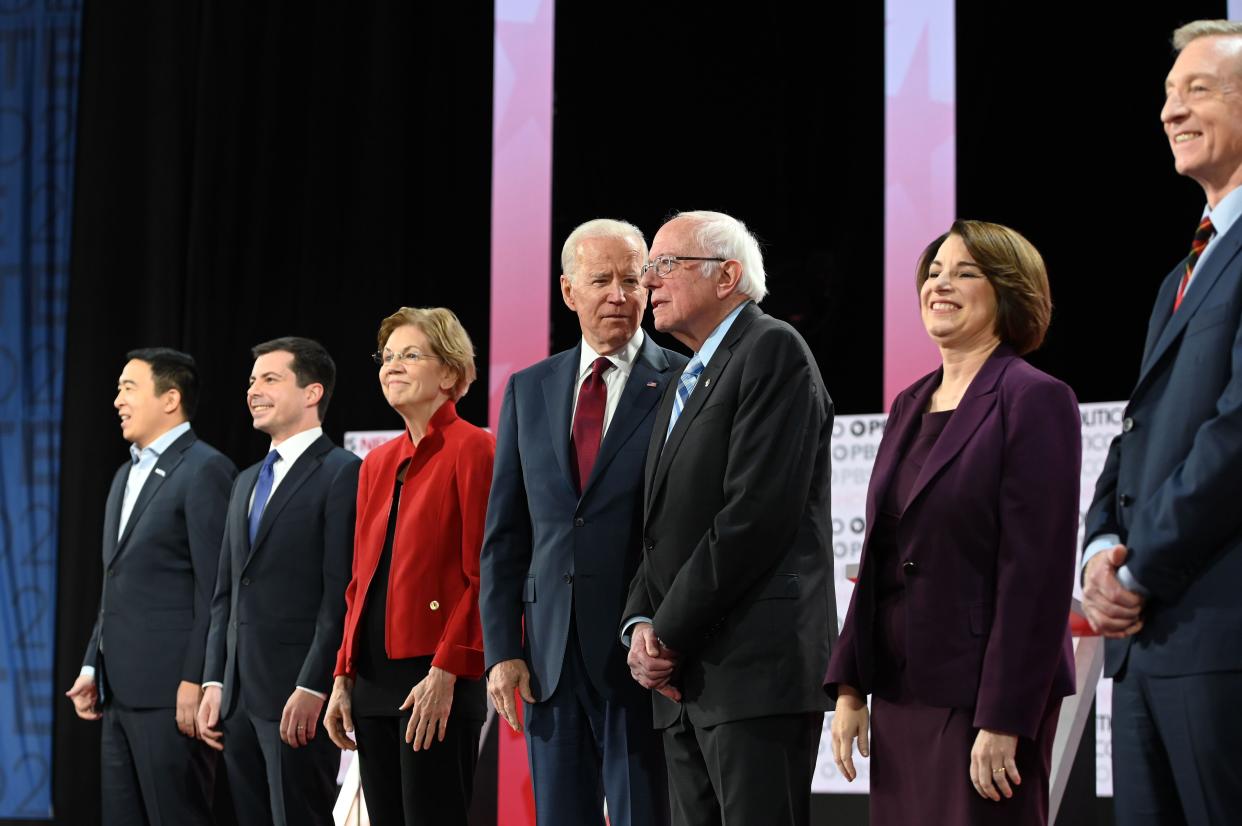 Democratic presidential hopefuls (L to R) Andrew Yang, Pete Buttigieg, Elizabeth Warren, Joe Biden, Bernie Sanders, Amy Klobuchar and Tom Steyer are all competing in Iowa on Monday.