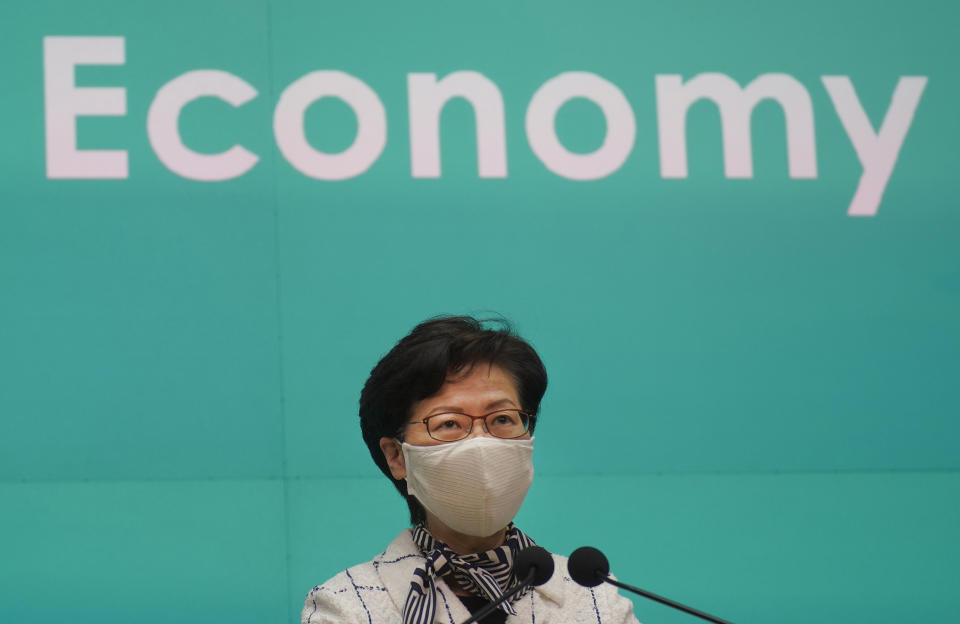 Hong Kong Chief Executive Carrie Lam listens to reporters' questions during a press conference in Hong Kong, Tuesday, June 16, 2020. Lam said she hoped that the opposition would not “demonize and stigmatize” the national security law as doing do would mean pitting themselves against the people of Hong Kong. (AP Photo/Vincent Yu)