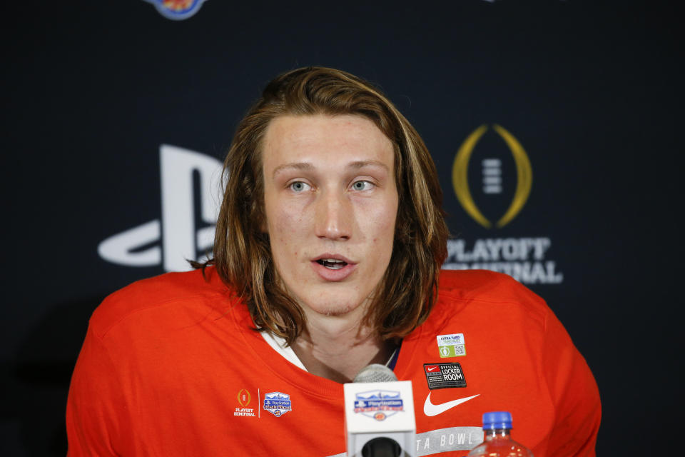 Clemson quarterback Trevor Lawrence speaks during a news conference after the team's 29-23 win over Ohio State in the Fiesta Bowl NCAA college football playoff semifinal Saturday, Dec. 28, 2019, in Glendale, Ariz. (AP Photo/Ross D. Franklin)