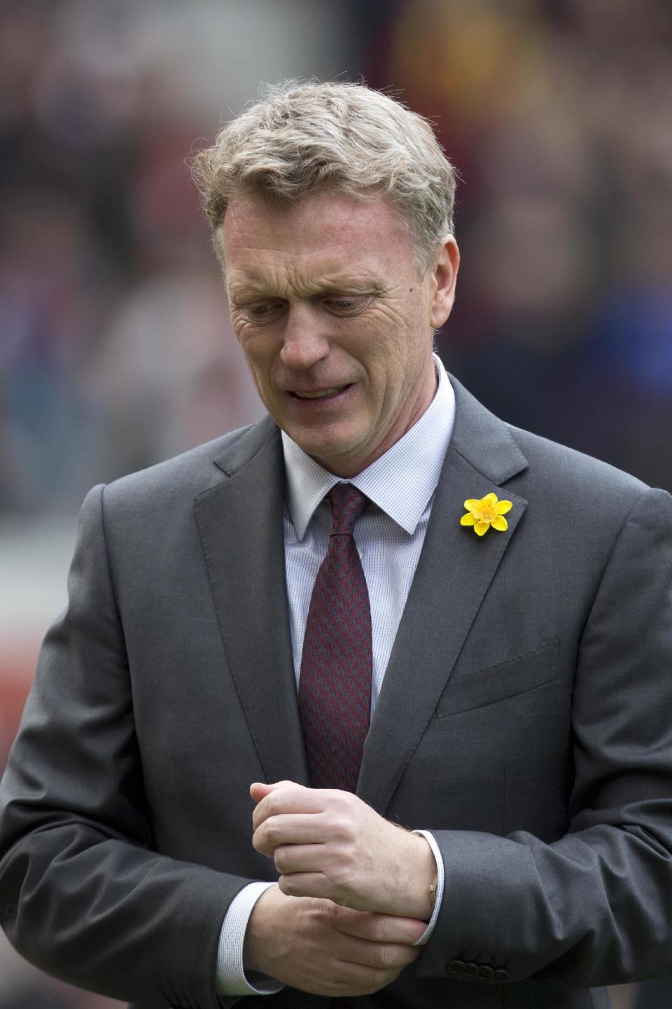 Manchester United's manager David Moyes takes to the touchline before his team's English Premier League soccer match against Liverpool at Old Trafford Stadium, Manchester, England, Sunday March 16, 2014. (AP Photo/Jon Super)